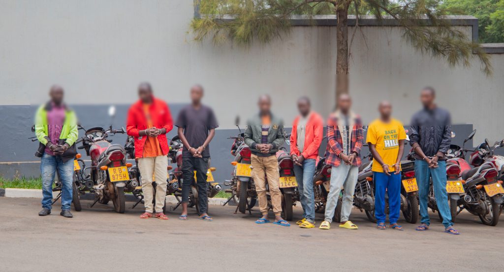 Police parade eight suspected of stealing, forging motorcycle plate numbers